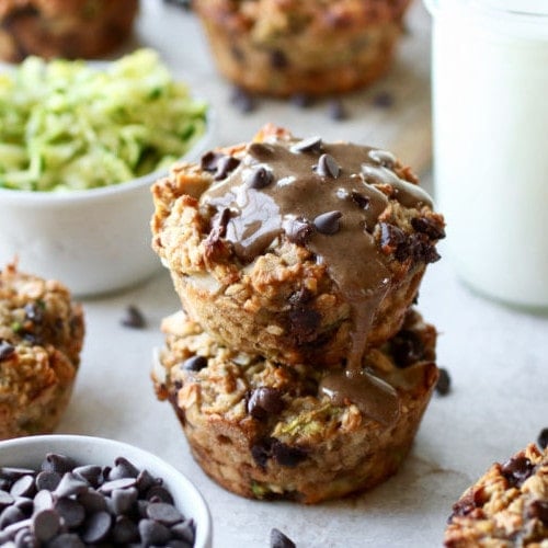Two zucchini oatmeal breakfast muffins stacked on top of each other as part of 6 freezer breakfast recipes