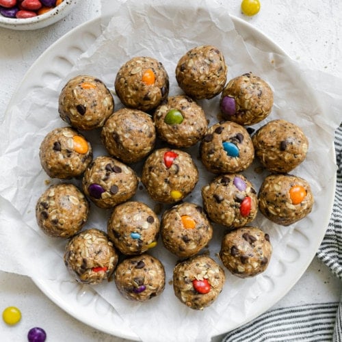 Overhead view monster cookie protein balls with colored candy pieces.